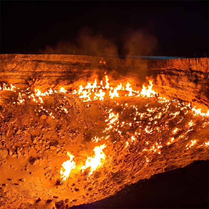 Darvaza gas crater burning at night in Karakum desert Turkmenistan